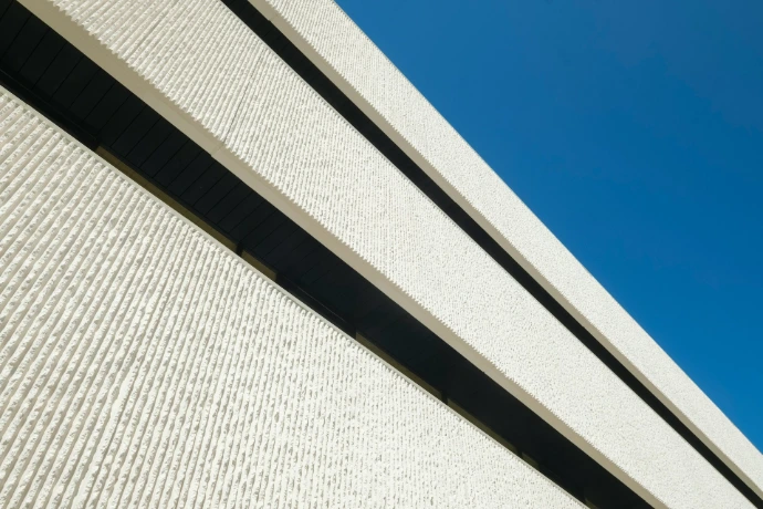 Close-up of a modern exterior roller shade with durable fabric and sleek architectural lines, providing stylish outdoor shade and sun protection.