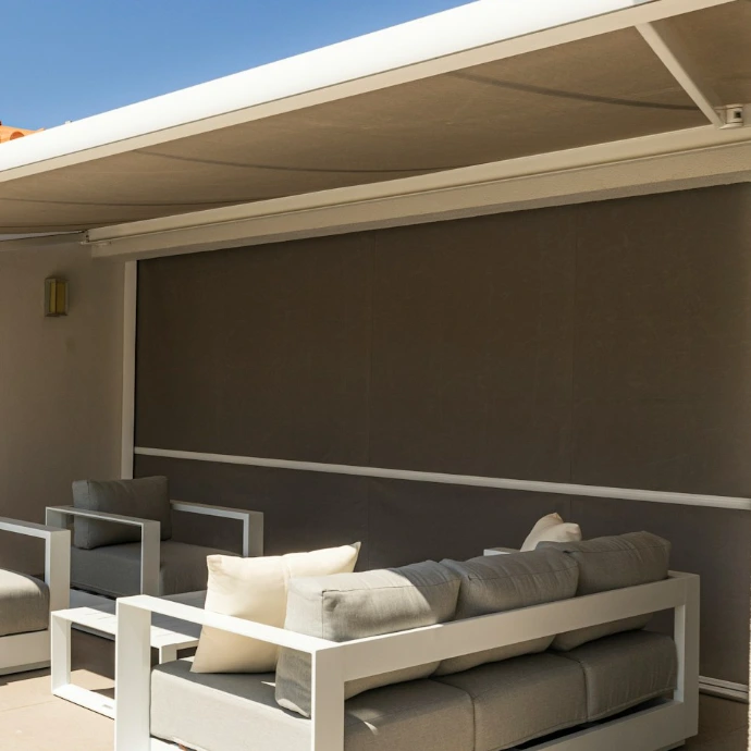 Custom exterior roller shades installed on a covered patio, providing sun protection, reduced heat, and enhanced comfort for outdoor living spaces.